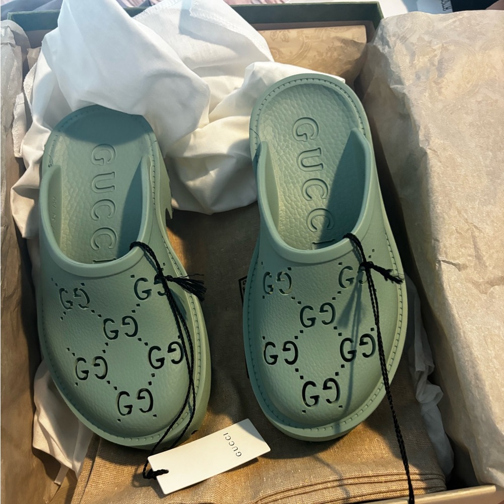 Gucci GG rubber clogs.